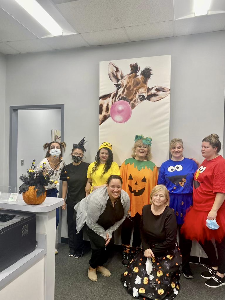 Image of the Honeygo Pediatric staff including nurses, office receptionists, Dr. Wieslawa D. Wisinski, Dr. Lee, Dr. Christina Halley, Dr. Murakoshi.